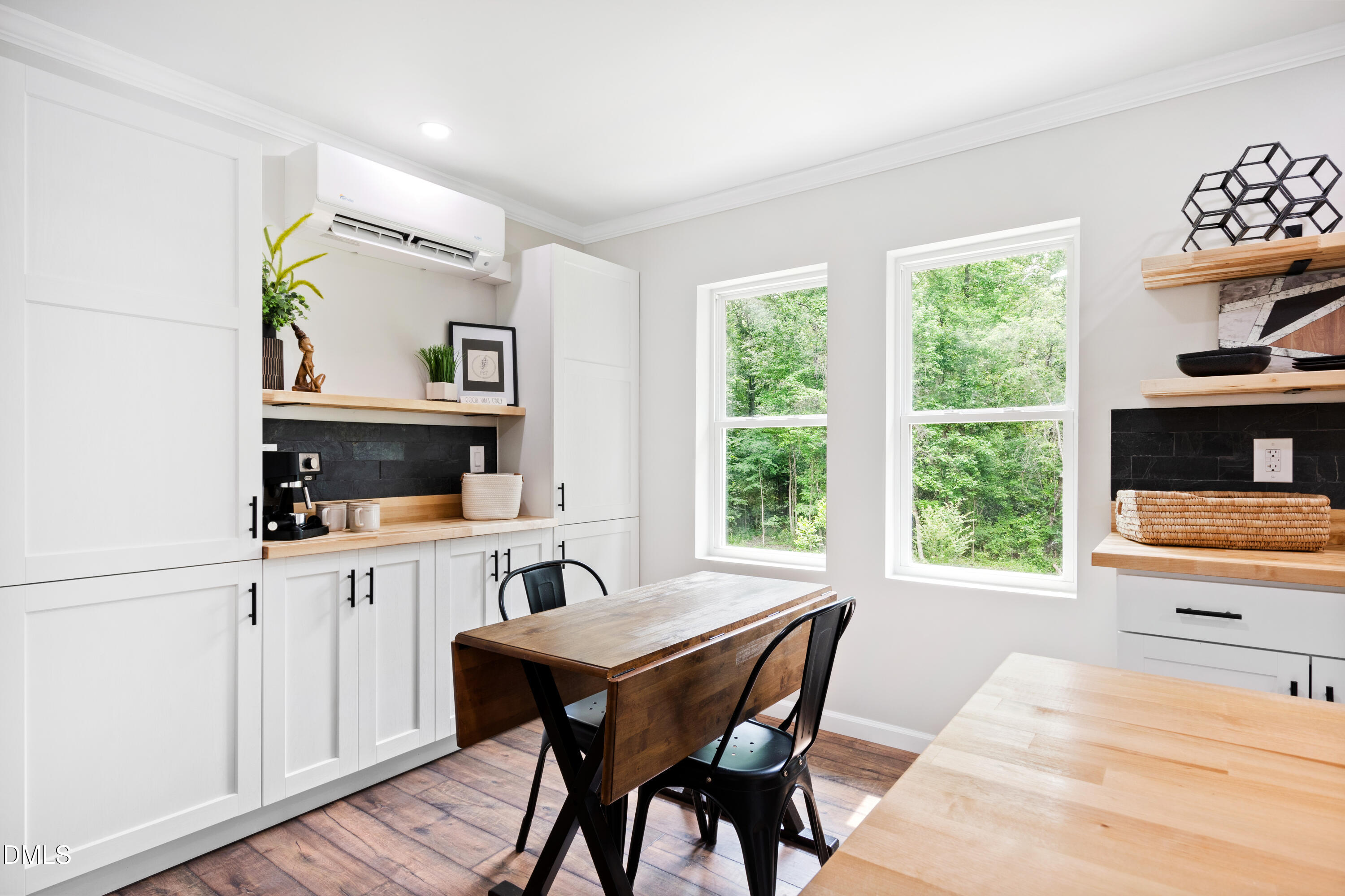 2153 Hurdle Mills Road Roxboro, NC 27574 - Photo 12 of 32 a view of a dining room with furniture window and wooden floor