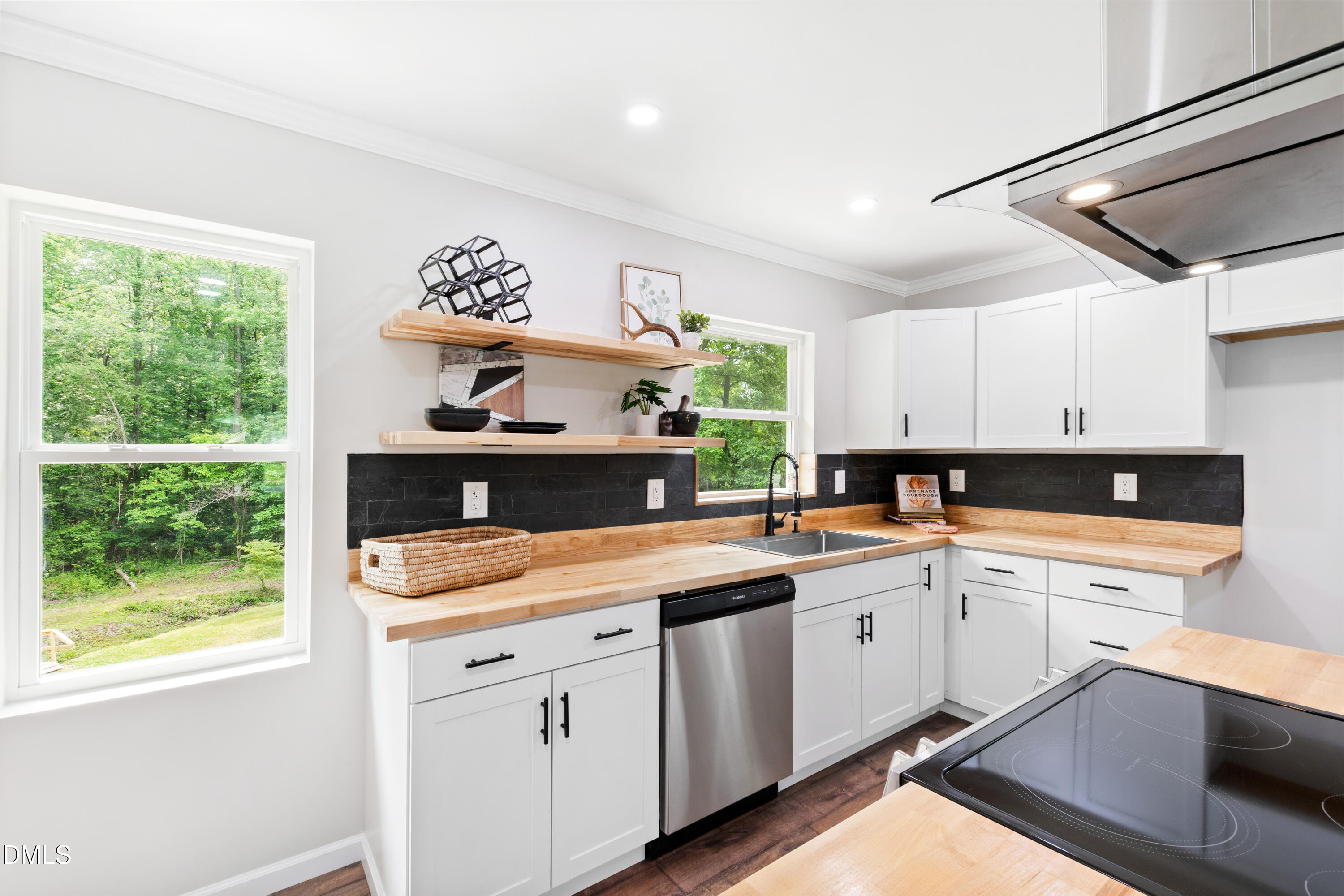 2153 Hurdle Mills Road Roxboro, NC 27574 - Photo 13 of 32 a kitchen with a sink cabinets and window