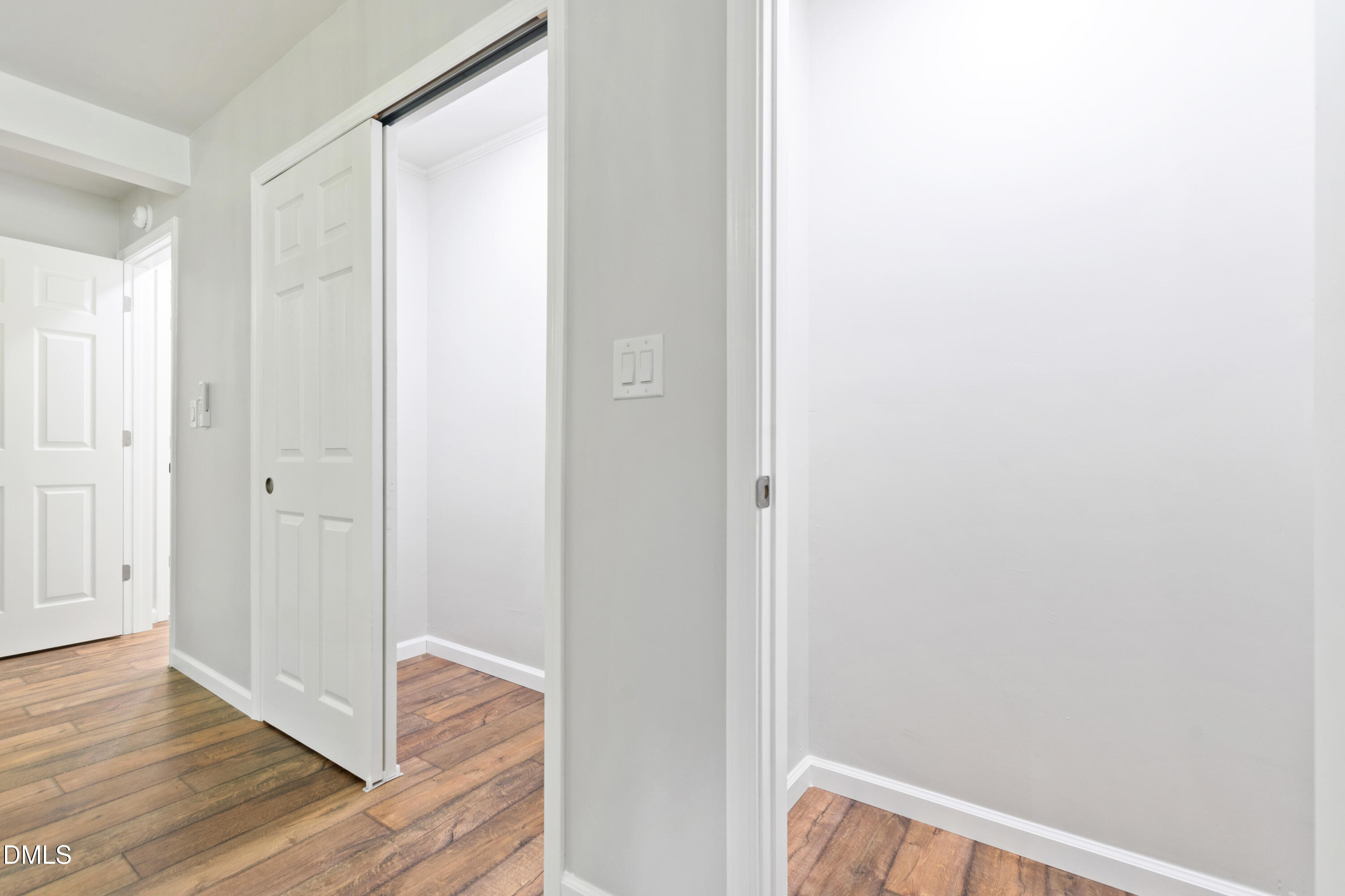2153 Hurdle Mills Road Roxboro, NC 27574 - Photo 19 of 32 a view of a hallway with wooden floor