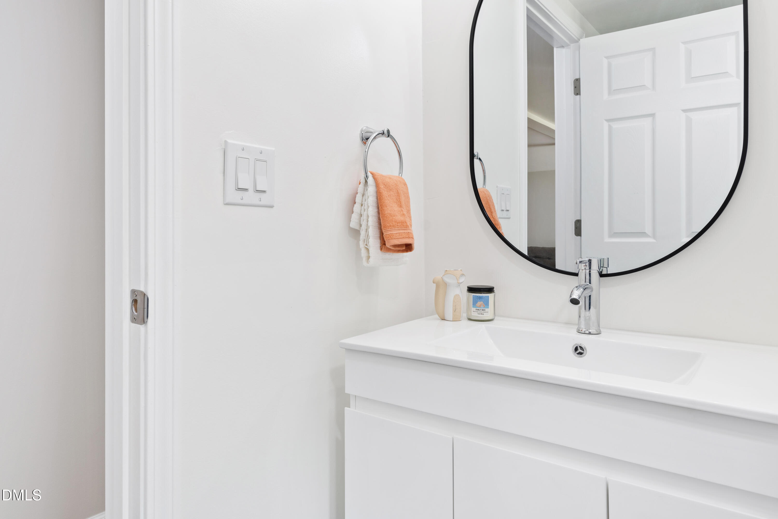 2153 Hurdle Mills Road Roxboro, NC 27574 - Photo 26 of 32 a bathroom with a sink and a mirror