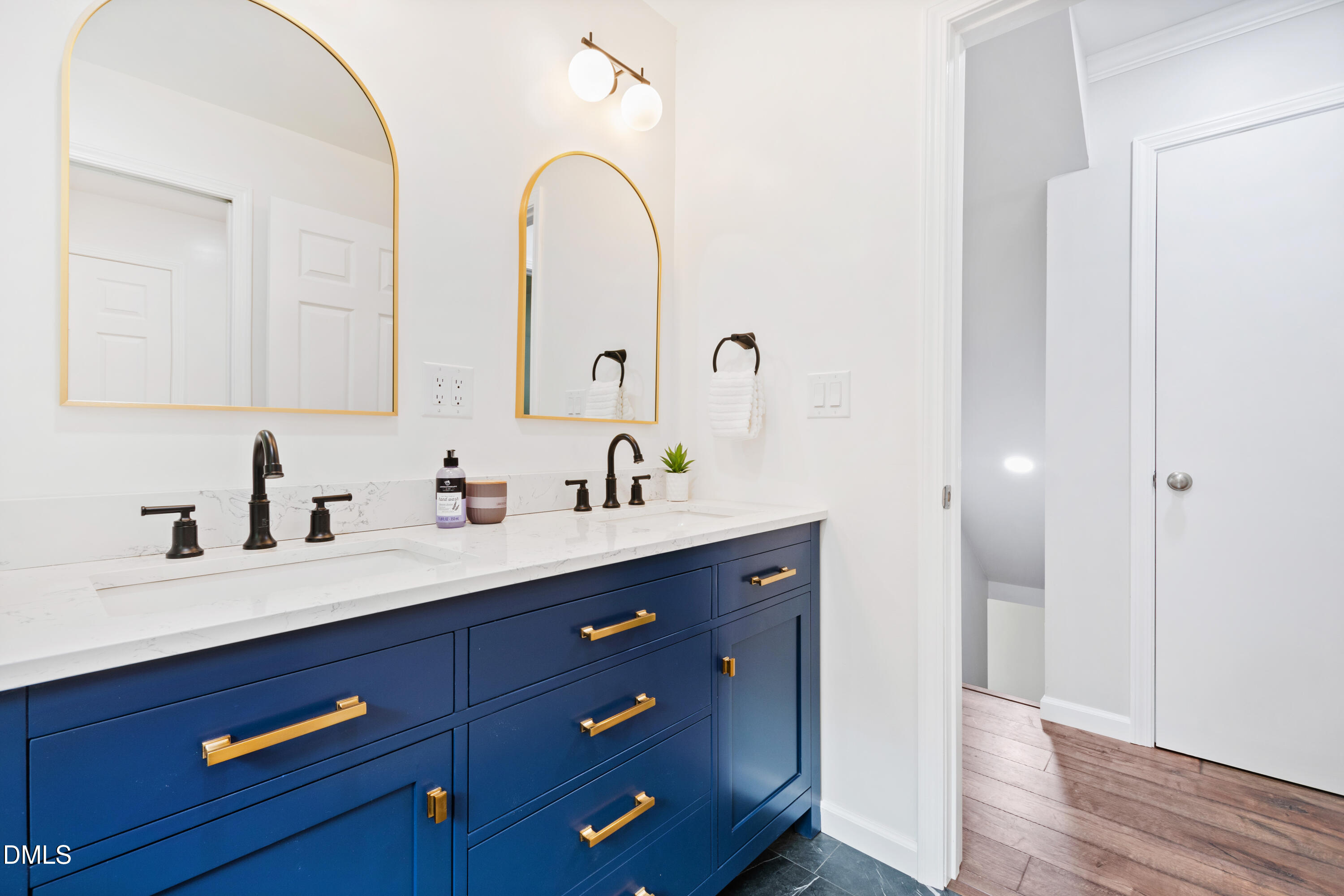 2153 Hurdle Mills Road Roxboro, NC 27574 - Photo 28 of 32 a bathroom with a sink and a mirror
