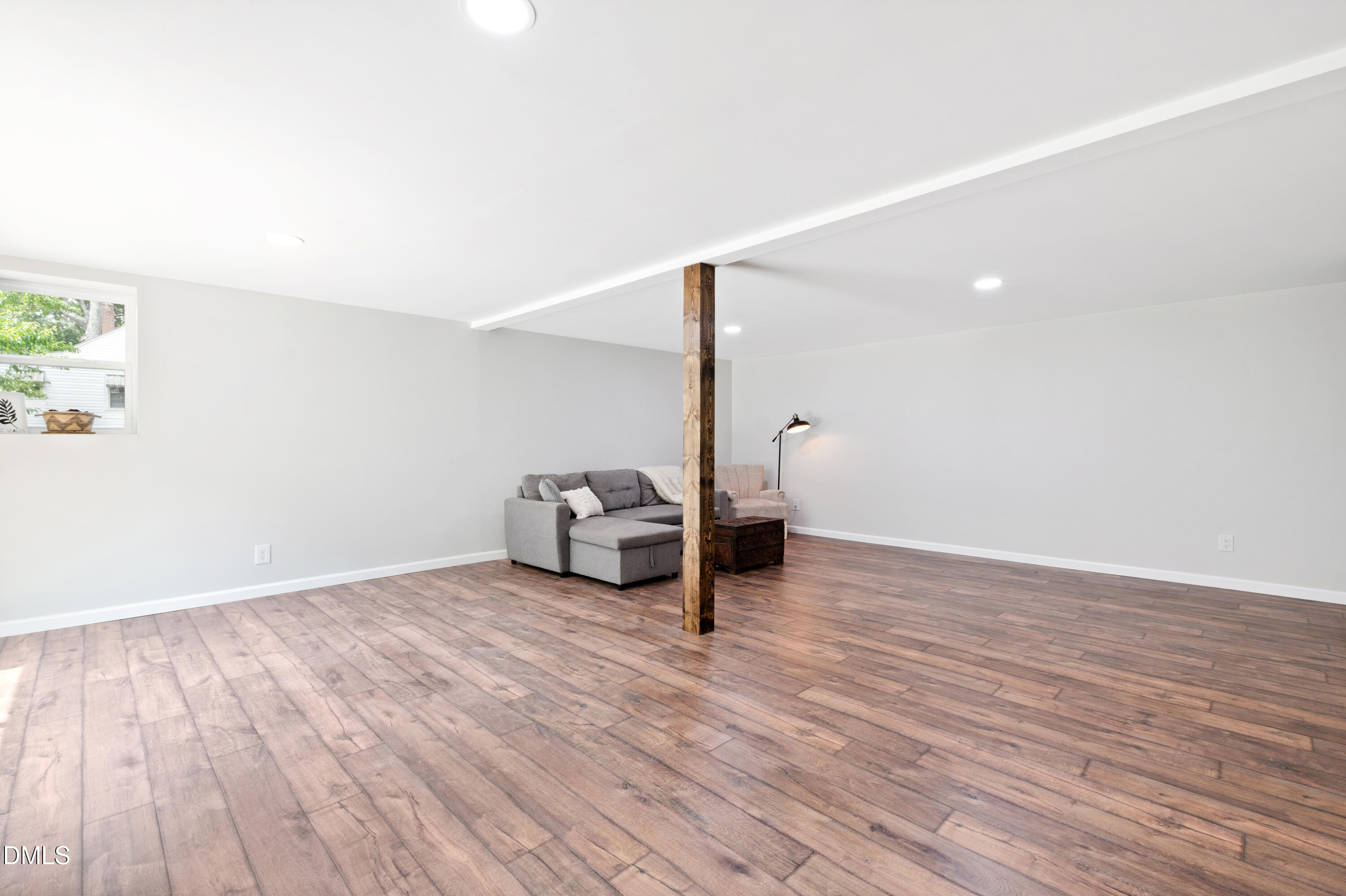 2153 Hurdle Mills Road Roxboro, NC 27574 - Photo 30 of 32 a view of a livingroom with wooden floor