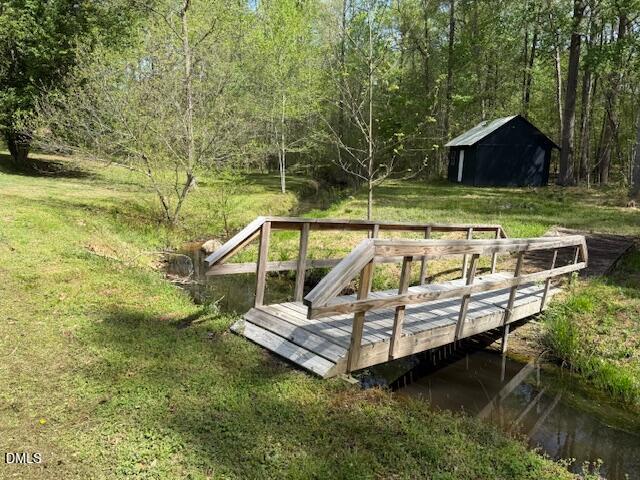 2153 Hurdle Mills Road Roxboro, NC 27574 - Photo 32 of 35 a view of a house with backyard and sitting area