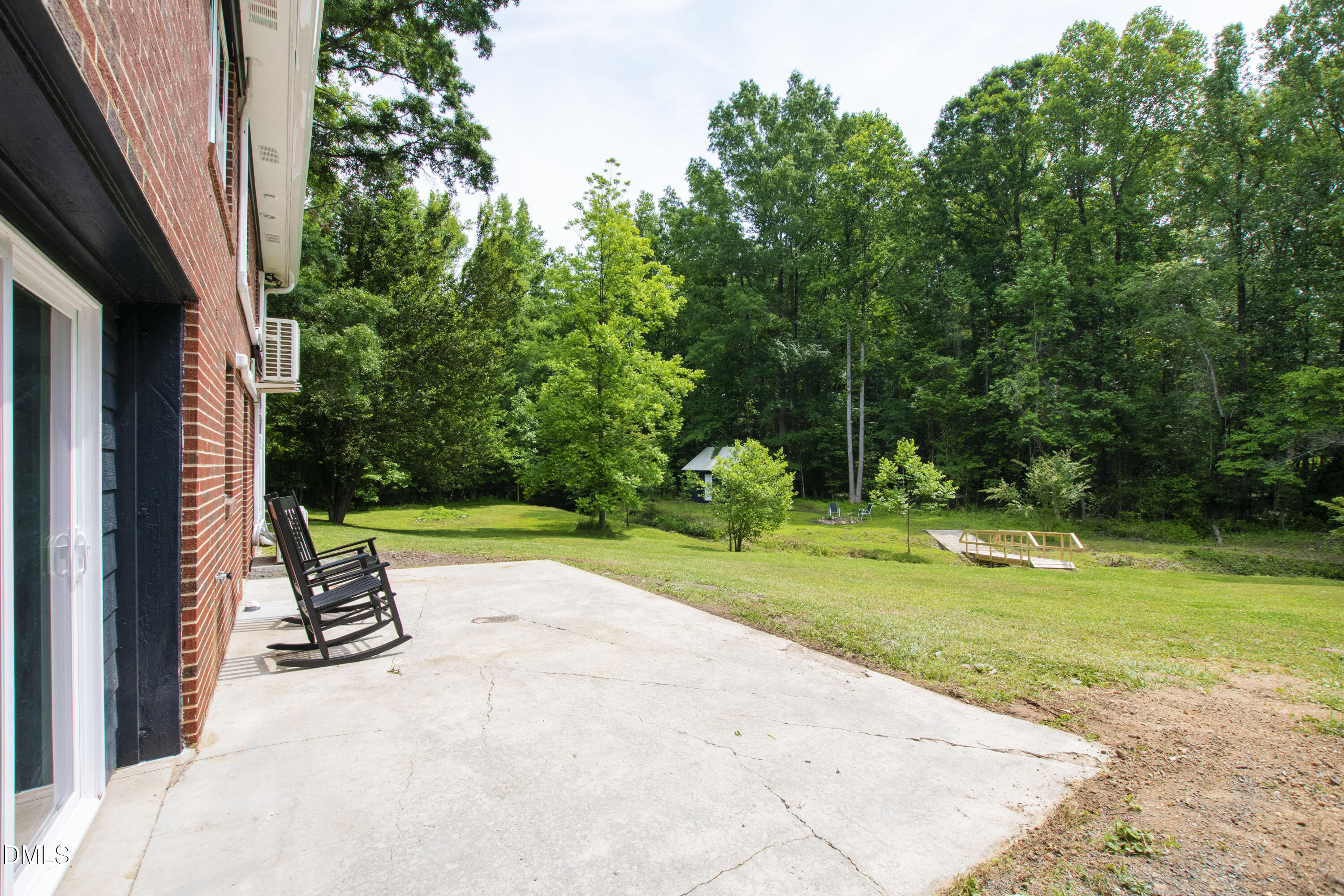 2153 Hurdle Mills Road Roxboro, NC 27574 - Photo 4 of 32 a park view with a outdoor seating