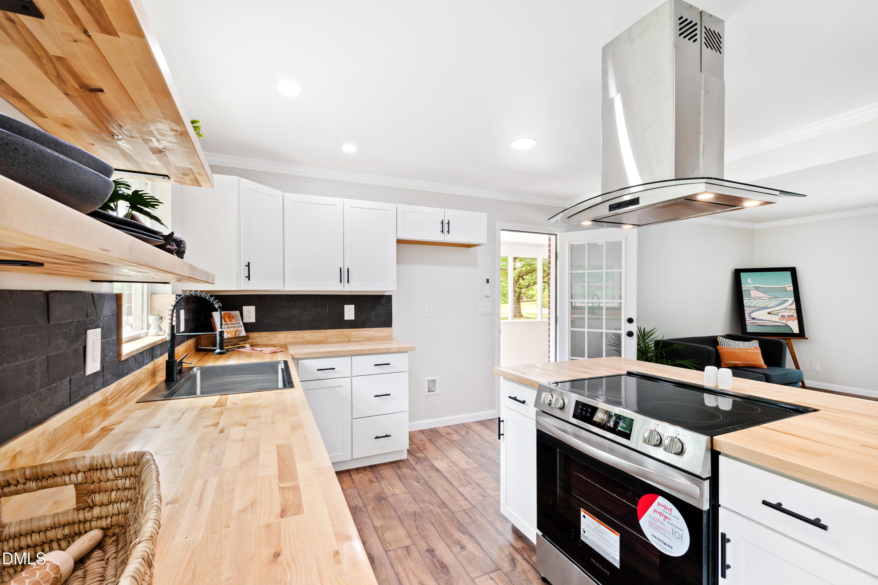 2153 Hurdle Mills Road Roxboro, NC 27574 - Photo 7 of 32 a kitchen with stainless steel appliances granite countertop a stove and a refrigerator