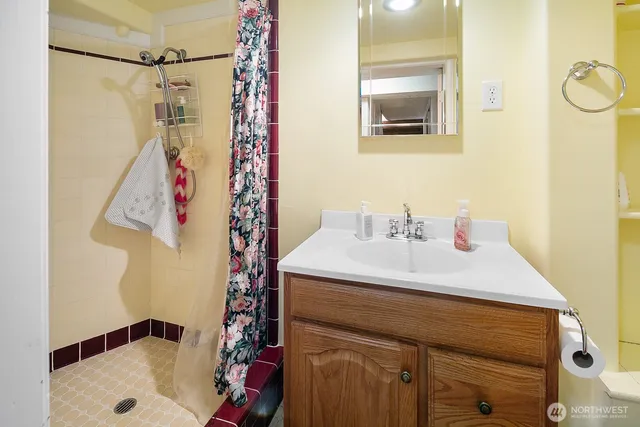 a bathroom with a sink and a mirror