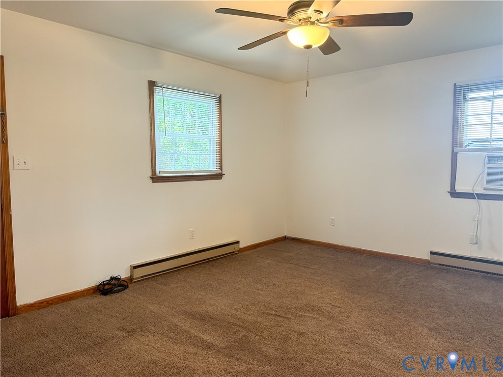 101 Lyons Avenue Colonial Heights, VA 23834 - Photo 8 of 10 an empty room with windows and fan