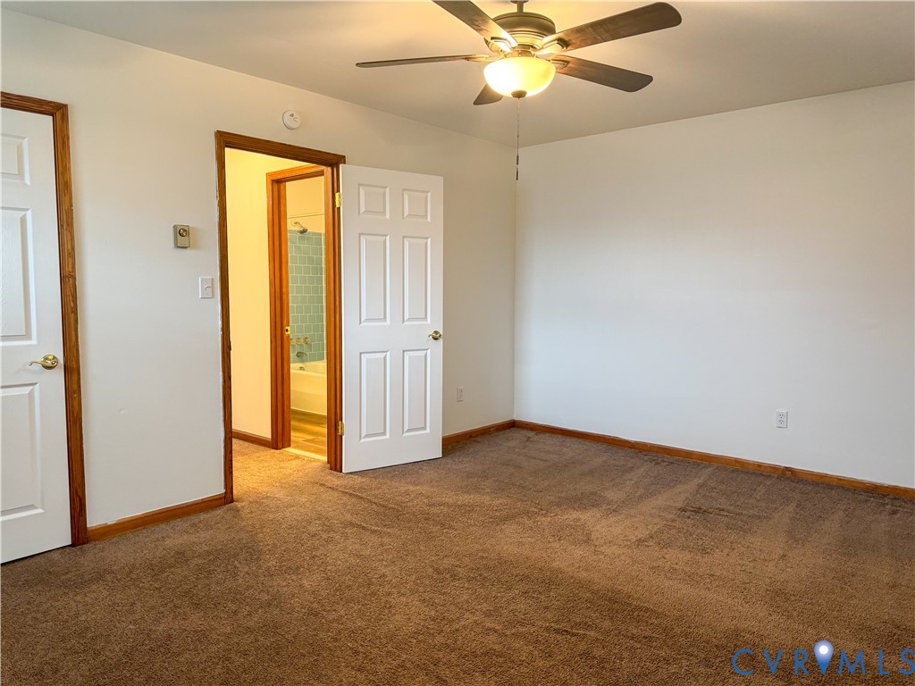 101 Lyons Avenue Colonial Heights, VA 23834 - Photo 10 of 10 an empty room with a ceiling fan and a window