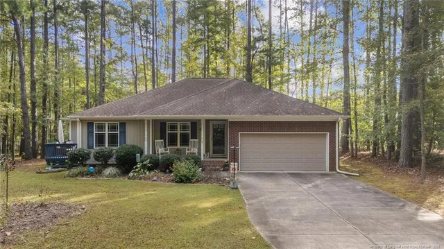 a view of a house with garden and yard