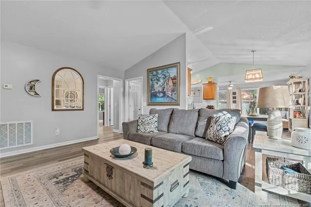 a living room with furniture and a window