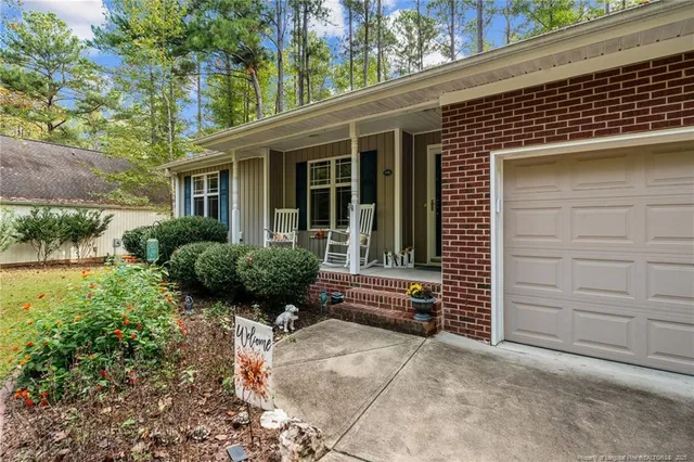 a view of house with a outdoor seating space