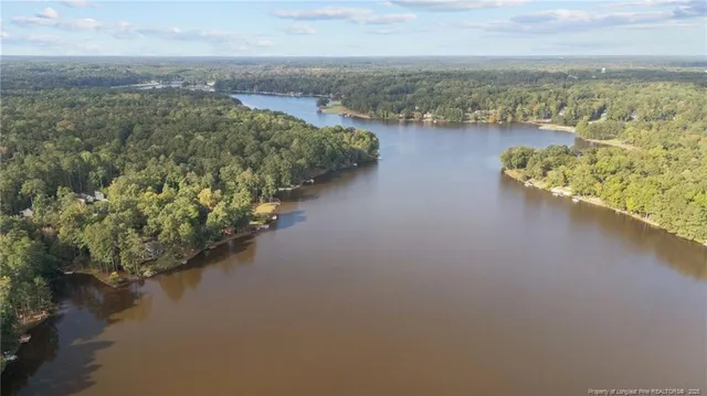 a view of a lake with beach and city view