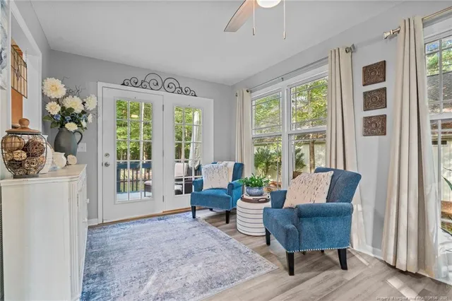 a living room with furniture and a window