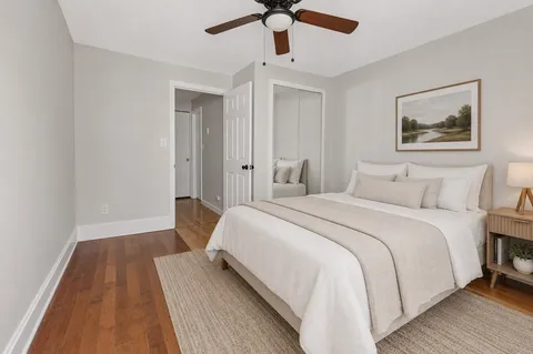 a bedroom with a bed and flat screen tv