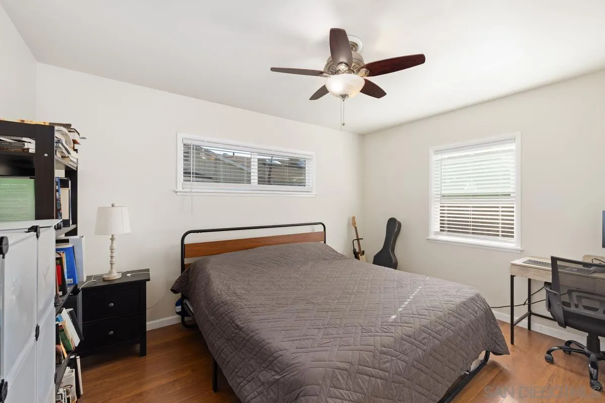 5826 Amarillo Avenue La Mesa, CA 91942 - Photo 11 of 20 a bedroom with a bed dresser and a flat tv screen