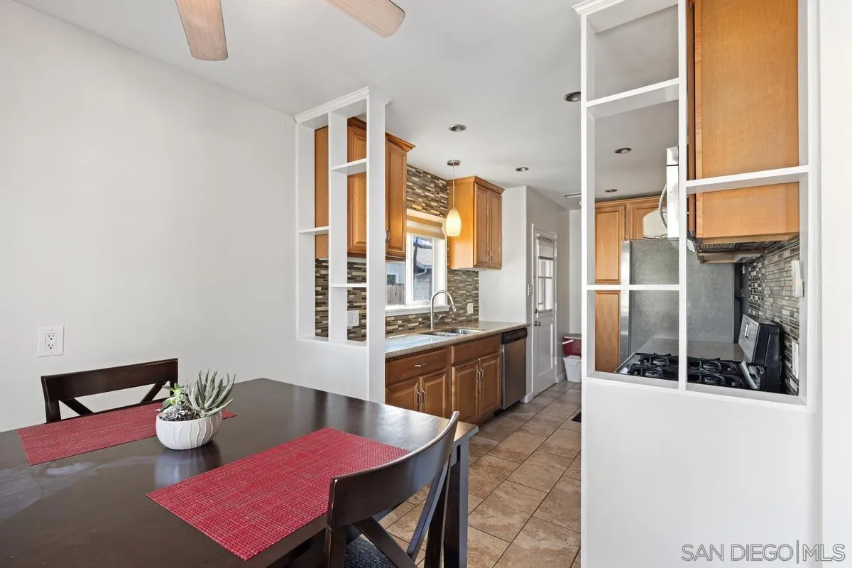 5826 Amarillo Avenue La Mesa, CA 91942 - Photo 3 of 20 a kitchen with a refrigerator and table