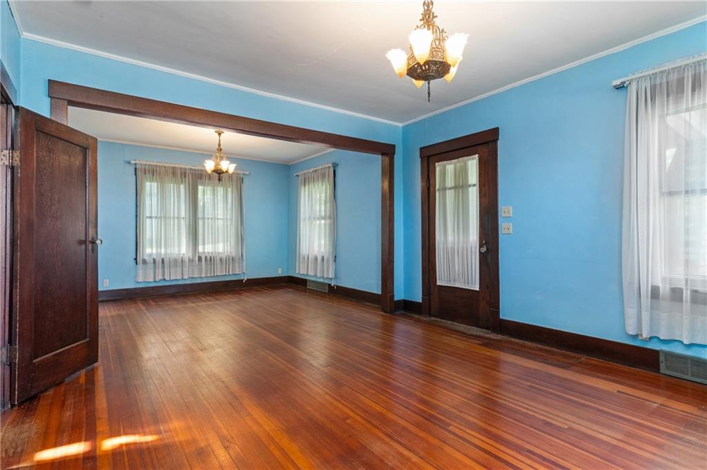 767 Fellsburg Road Belle Vernon, PA 15012 - Photo 12 of 30 an empty room with wooden floor and windows