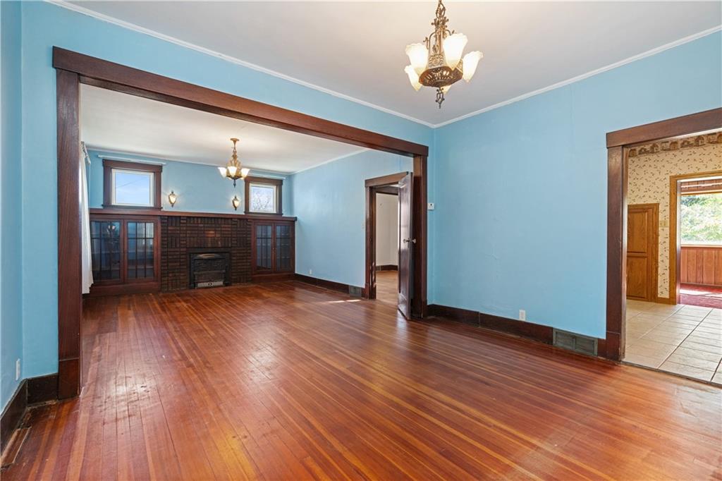 767 Fellsburg Road Belle Vernon, PA 15012 - Photo 13 of 30 a view of a livingroom with wooden floor and kitchen