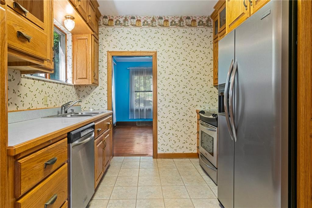 767 Fellsburg Road Belle Vernon, PA 15012 - Photo 16 of 30 a kitchen with stainless steel appliances granite countertop a refrigerator and a sink