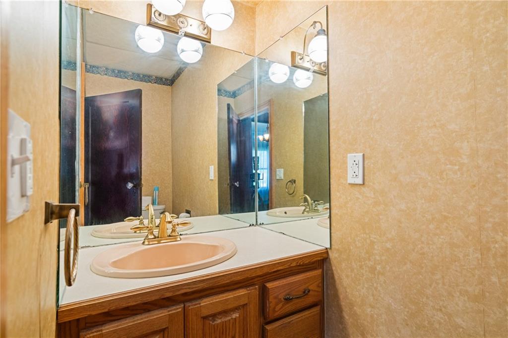 767 Fellsburg Road Belle Vernon, PA 15012 - Photo 17 of 30 a bathroom with a sink and a mirror