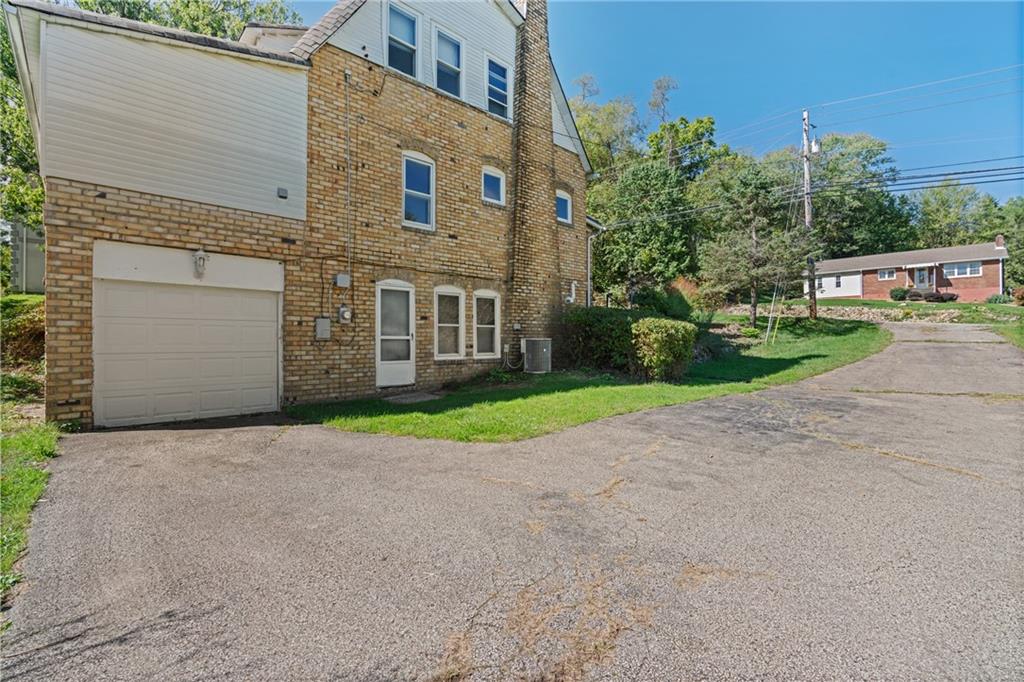 767 Fellsburg Road Belle Vernon, PA 15012 - Photo 4 of 30 a view of a house with a yard and garage