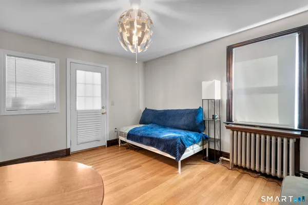 a living room with furniture and a chandelier
