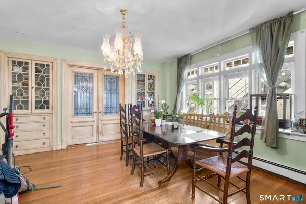 a view of a dining room with furniture window and outside view