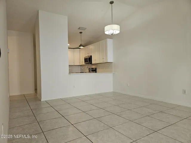 a outdoor dining space with furniture and outdoor view