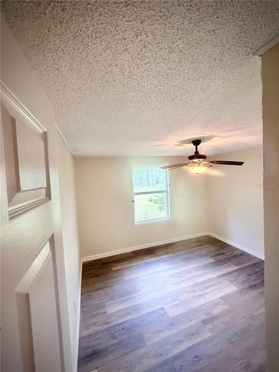 375 Pine Woods Road Ormond Beach, FL 32174 - Photo 10 of 16 an empty room with windows and entrance