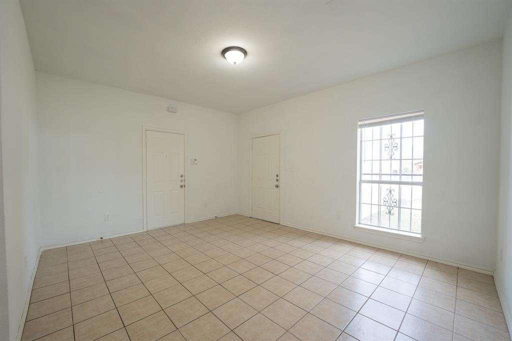 1302 Hendricks Avenue Dallas, TX 75216 - Photo 3 of 12 an empty room with windows