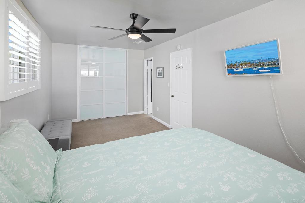 10033 Woodpark Drive Santee, CA 92071 - Photo 11 of 21 a bedroom with a large bed and a window