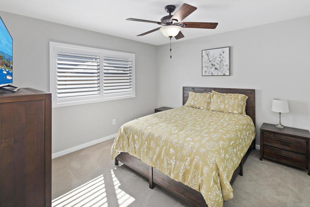 10033 Woodpark Drive Santee, CA 92071 - Photo 13 of 21 a bedroom with a bed and a window