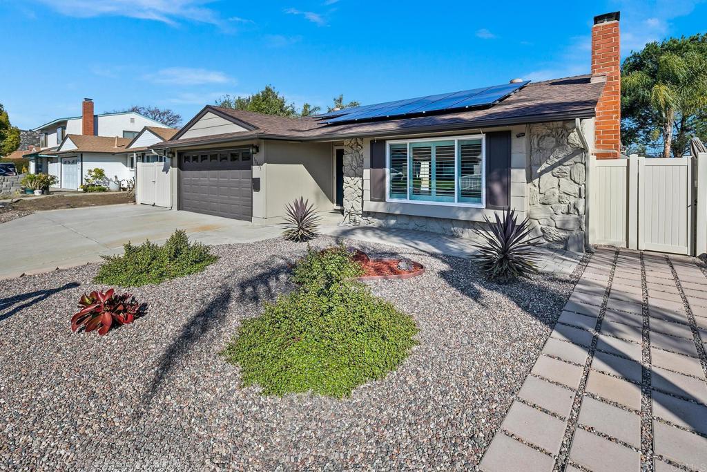 10033 Woodpark Drive Santee, CA 92071 - Photo 2 of 21 a front view of a house with a garden