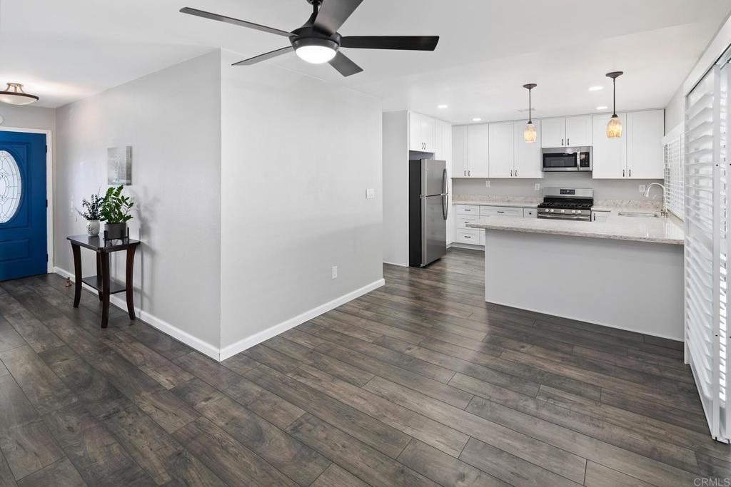 10033 Woodpark Drive Santee, CA 92071 - Photo 6 of 21 a view of kitchen with stainless steel appliances refrigerator stove microwave and cabinets