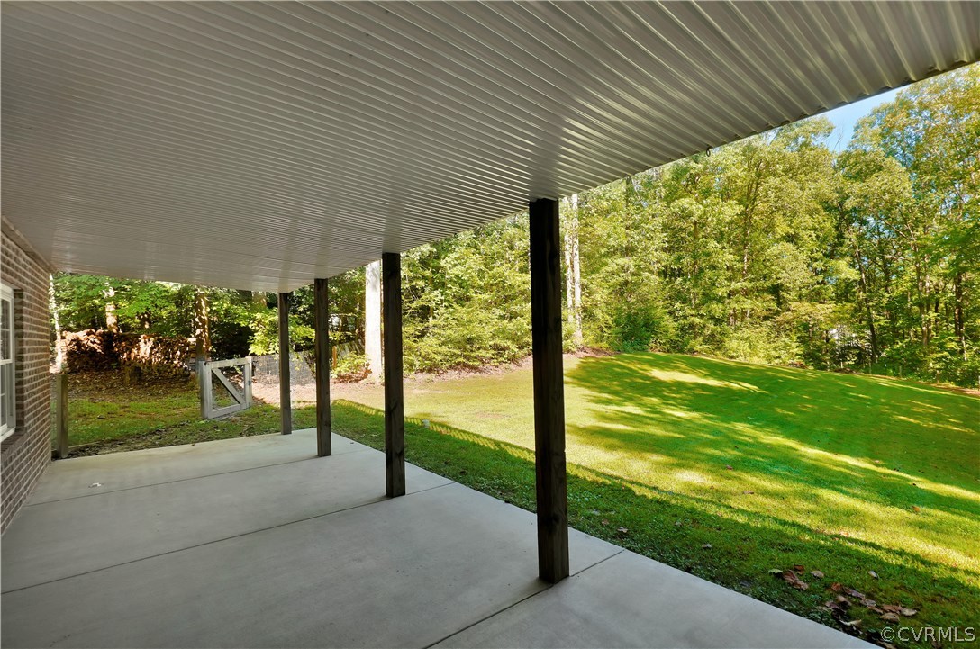 3650 Whitehall Road Sandy Hook, VA 23153 - Photo 38 of 45 a view of a porch and garden