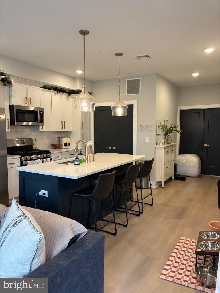 7517 Ridge Avenue Philadelphia, PA 19128 - Photo 2 of 8 Modern kitchen with stylish island seating.