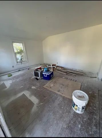 a view of a room with a dishwasher and a stove
