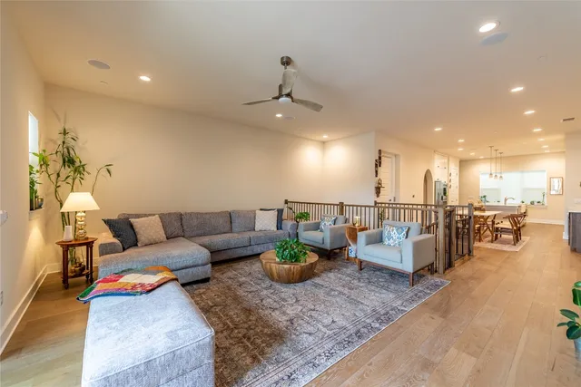 a living room with furniture and kitchen view
