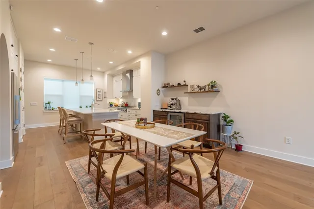 a kitchen with a sink a counter top space stainless steel appliances and cabinets