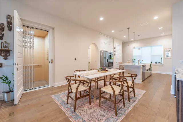 a kitchen with stainless steel appliances a sink stove and refrigerator