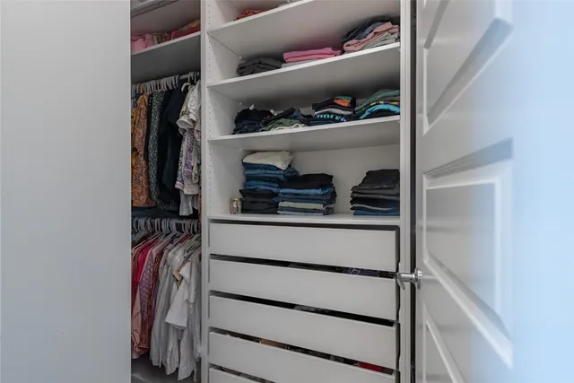 a bedroom with bed and a window