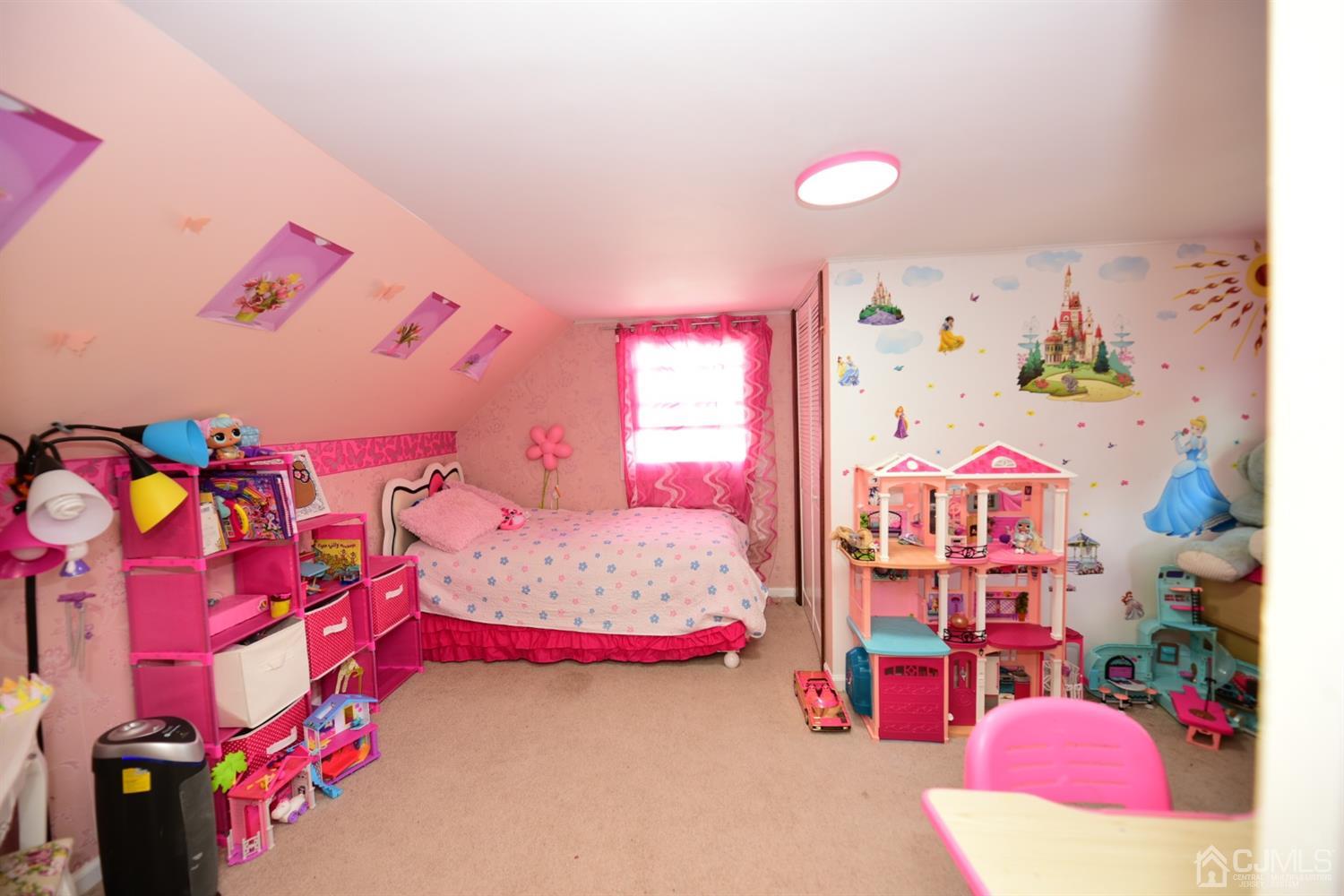 103 Tunison Road New Brunswick, NJ 08901 - Photo 15 of 30 a bedroom with a bed and a couch