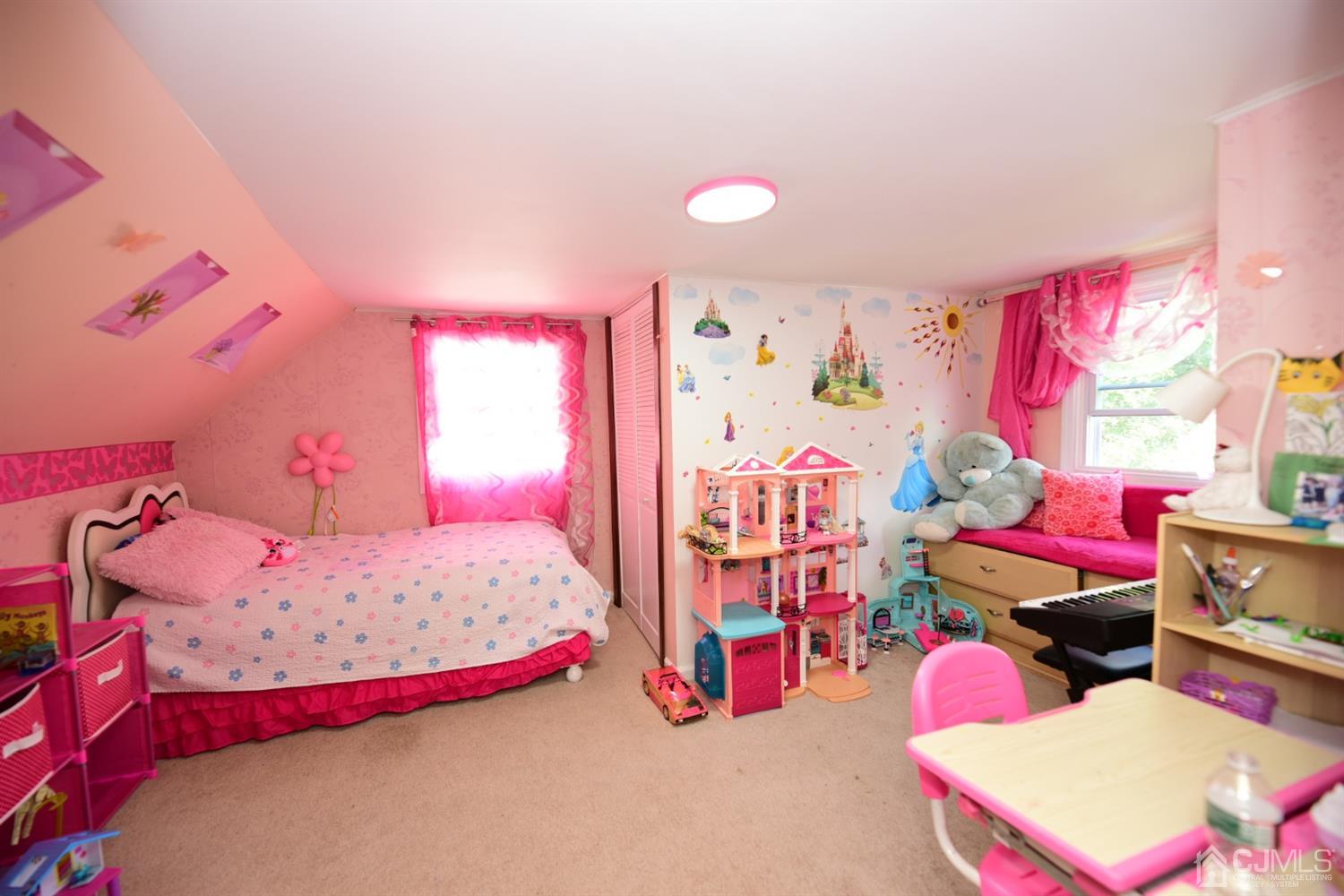 103 Tunison Road New Brunswick, NJ 08901 - Photo 16 of 30 a bedroom with bed and a bed