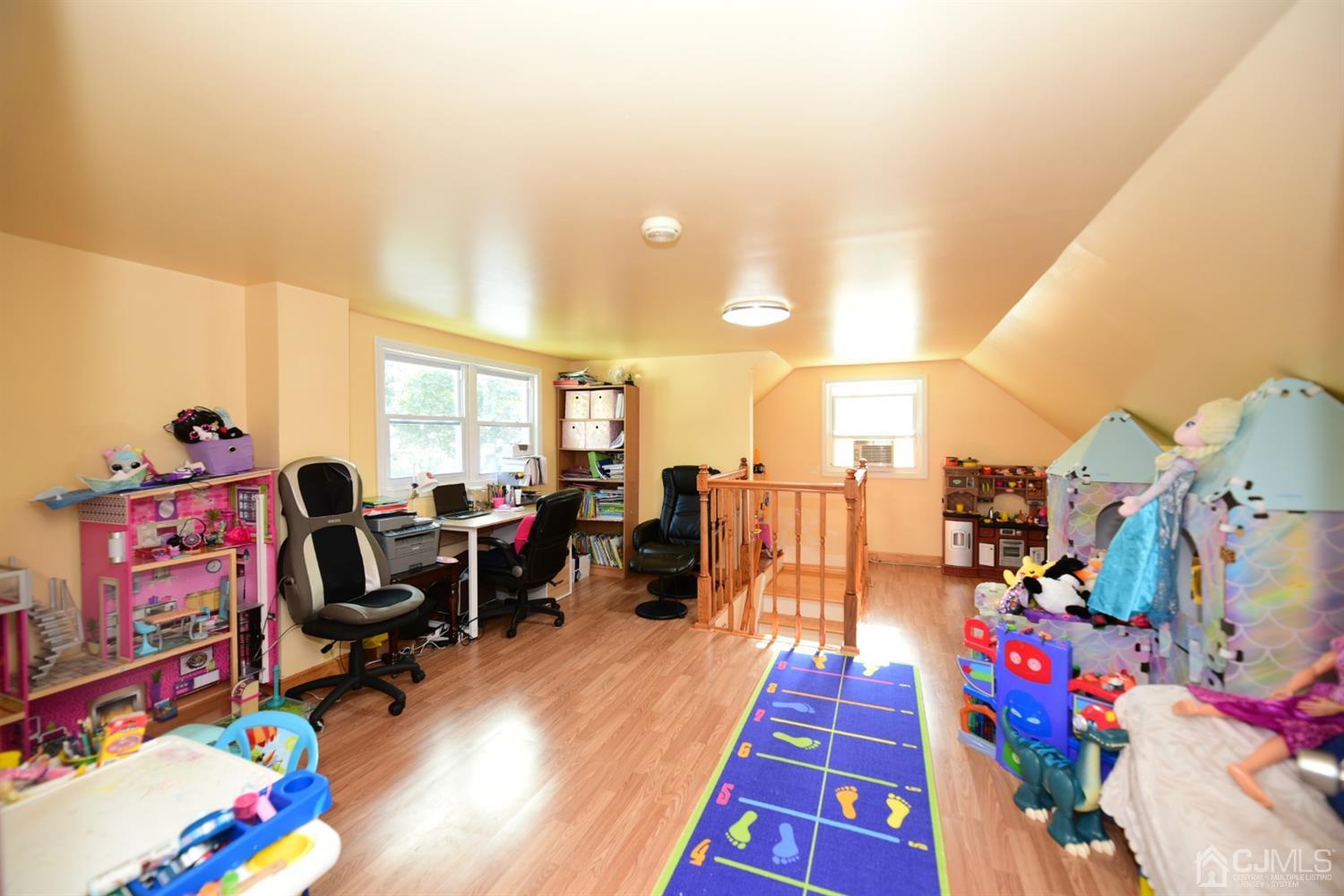 103 Tunison Road New Brunswick, NJ 08901 - Photo 19 of 30 a workspace with furniture and toys