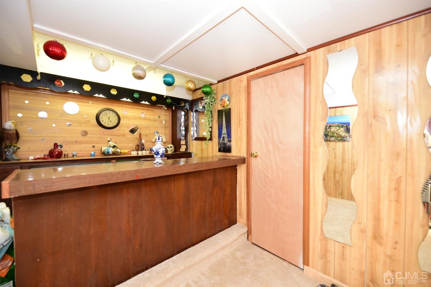 103 Tunison Road New Brunswick, NJ 08901 - Photo 24 of 30 a bathroom with a mirror and a sink