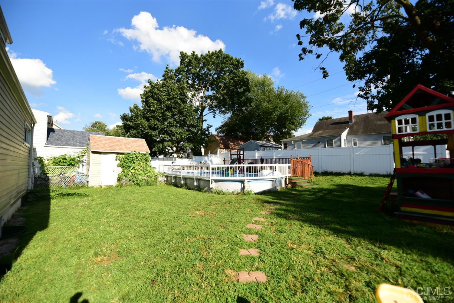 103 Tunison Road New Brunswick, NJ 08901 - Photo 27 of 30 a view of a house with a yard