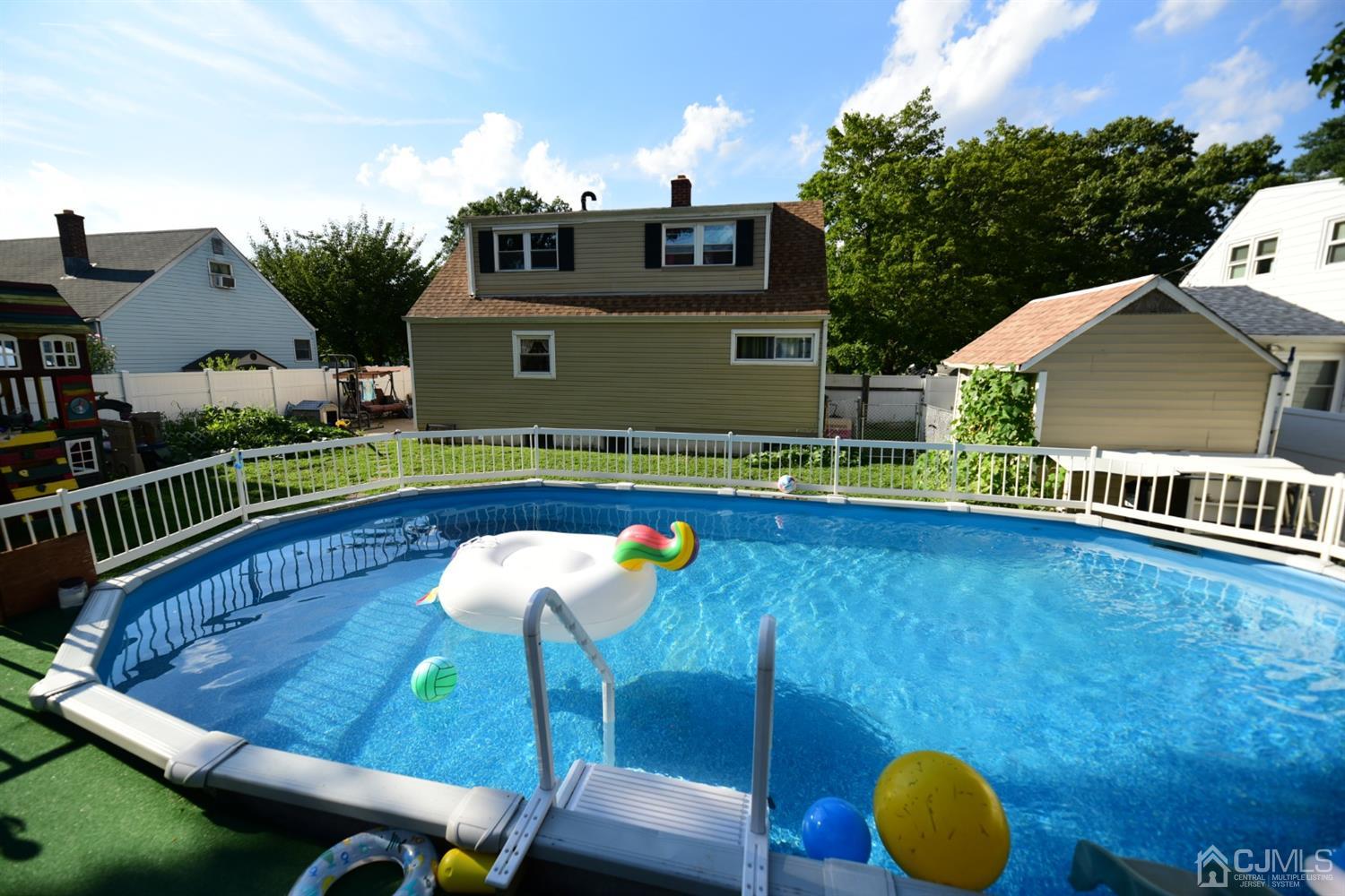 103 Tunison Road New Brunswick, NJ 08901 - Photo 28 of 30 an aerial view of a house roof deck with chairs and a table