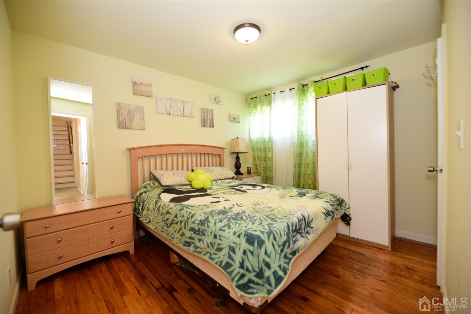 103 Tunison Road New Brunswick, NJ 08901 - Photo 9 of 30 a bedroom with a bed and a window