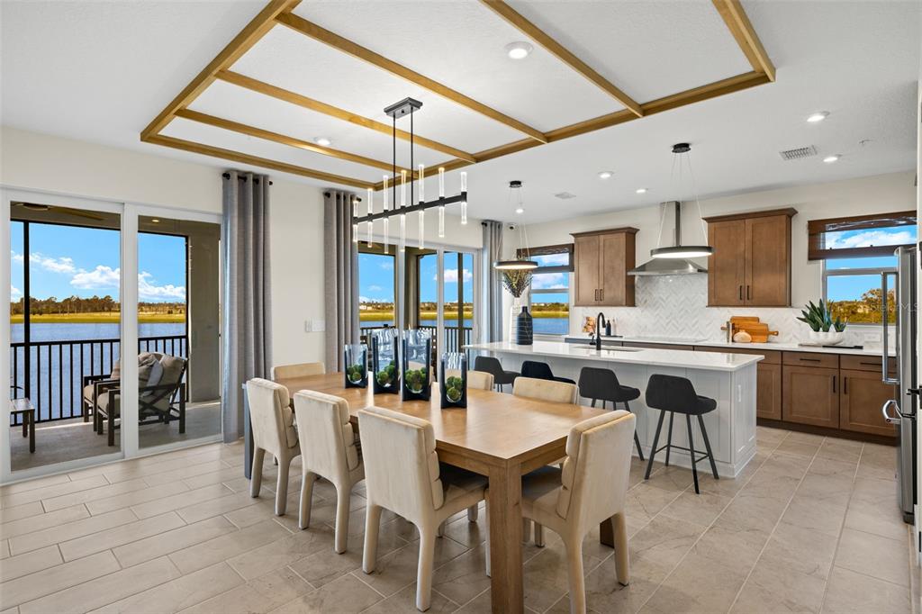 12785 Jade Empress Loop, Unit 202 Venice, FL 34293 - Photo 13 of 42 a large kitchen with a table and chairs