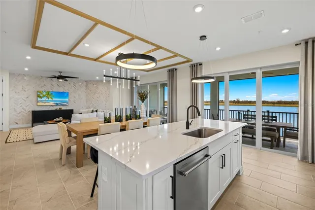 a kitchen with stainless steel appliances kitchen island granite countertop a sink and cabinets